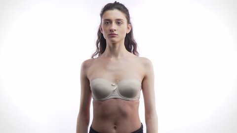 beautiful busty nude woman standing concealing Stock Footage Video (100