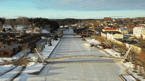 Porvoo, Finland - 26 February 2019. Aerial view of the village, forest and bridge across the frozen river