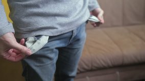 man shows turns empty pockets bankrupt no money. poverty Finance business bankruptcy concept. a man in old jeans looking for money in his pockets. lifestyle crisis of getting into debt. problems and - Powered by Shutterstock - Get 15% off with code: PIKWIZARD15