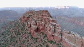 Recognizable wide aerial sliding shot across rocky terrain of mountain canyons vast. Astonishing sight of the desert landscape - 4K drone shot.