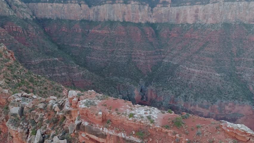 Aerial 4K view of truly iconic American scene of supreme wilderness of the canyon. Scenic panorama of the mile-deep Grand Canyon.
