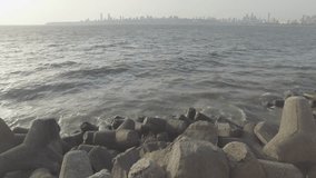 Marine drive mumbai video. Waves reaching the shore as sunset nears.