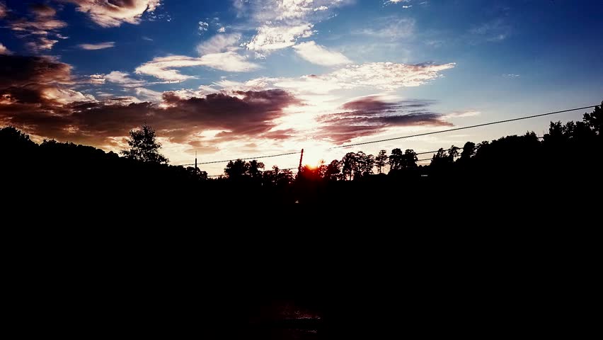 Beautiful sunset sky above clouds with dramatic light. hd