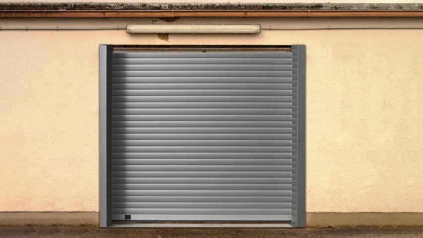 Metal roll-up commercial door opening with green screen or chroma key background effect. Ideal for store, motel, garage, workshop, parking lot, warehouse. Automatic security gate. 4k animation Royalty-Free Stock Footage #1025639186