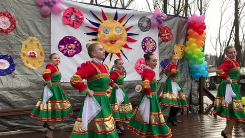 Russian, folk dance, performed by girls in bright, elegant dresses. Annual holiday Maslenitsa. Moscow Russia. March 10, 2019