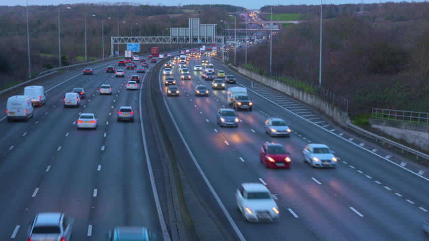 M25, Greater London, UK - Jan 2019: People driving at dusk in the winter