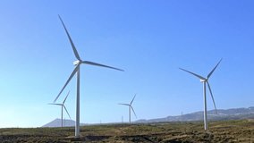 Wind turbines with rotating blades on Tenerife, Canary Islands.