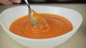 Eating healthy, vegetarian pumpkin soup. Not appetite. Healthy diet concept. The recipe video is a step by step of making vegetable soup