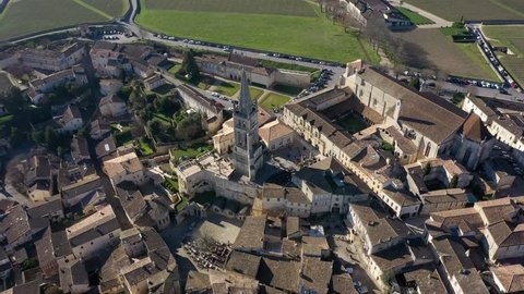drone flies over the rooftops of Saint-Émilion and gives a nice view of the historic buildings of this small idyllic town in france
