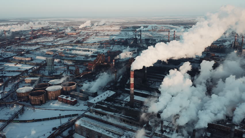 Drone panning of industrial park, many smoke stack pipes of steel plant, technogenic landscape in winter sunny evening, concept of pollution, air emissions from manufacturing sector, industrial city Royalty-Free Stock Footage #1025675342