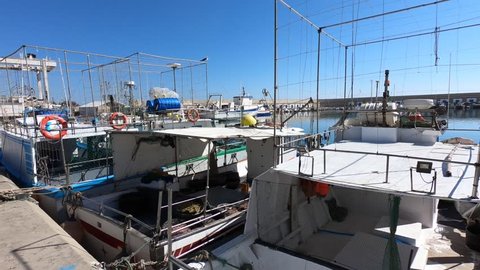 MARCH 03, 2019, CARBONERAS, ALMERIA, ANDALUCIA, SPAIN: A panning view of fishing boats in port, Mediterranean sea