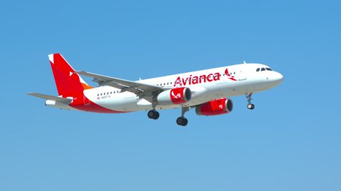 MIAMI, FL - 2019: Avianca Airlines Airbus A320 Commercial Jet Airliner Landing at MIA Miami International Airport Arriving from Colombia on a Sunny Day in South Florida