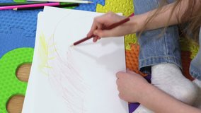 Little Girl drawing landscape on white paper