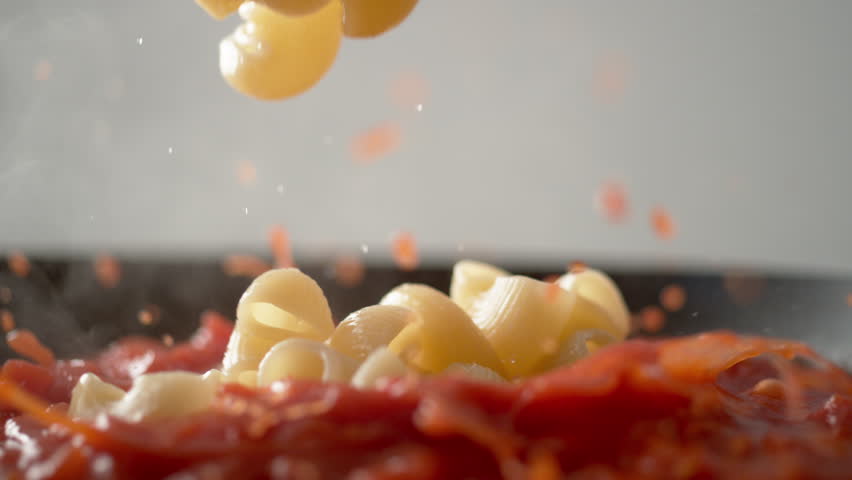 Camera follows cooking elbow macaroni pasta in tomato sauce. Shot with high speed camera, phantom flex 4K. Slow Motion. Royalty-Free Stock Footage #1025687492