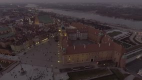 4K. Aerial view of the old town of Warsaw at night. Royal Castle, Warszawa Poland. Dusk
