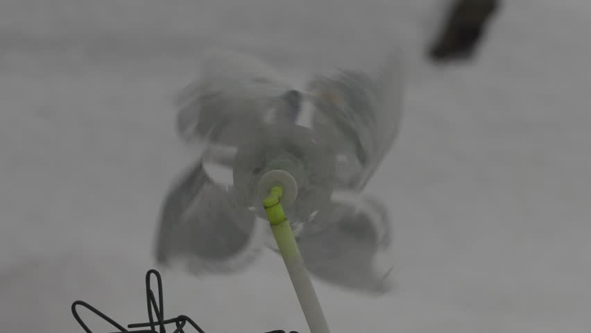 windmill toy reluctantly spinning in the wind