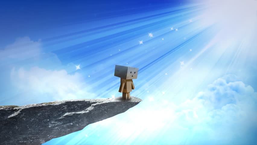 Cardboard Character Heavenly Light 4K Loop features a cardboard box character standing on the overhang of a cliff looking up at beams of light and animated stars coming down from heaven