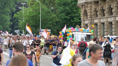 STRASBOURG, FRANCE - CIRCA 2018: People marching gathering near gay truck techno music at pride gays and lesbians parade marching French streets dancing fun party atmosphere
