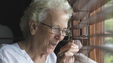 Senior Lady Peeping Through Blinds Surprised Stock Footage Video (100%
