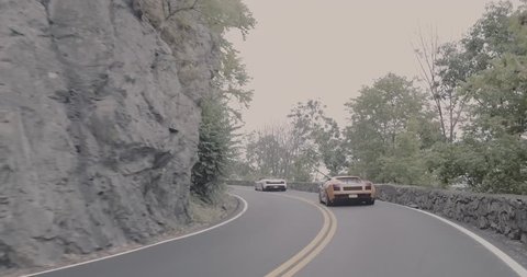 Paramus,NJ - 2/17/19 - Lamborghini’s driving passed rocks.
