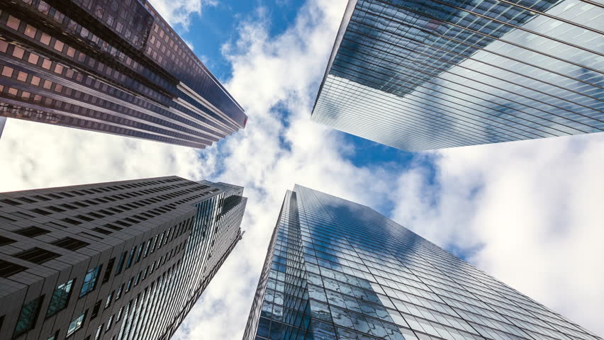 Downtown Toronto time lapse view, looking up at office building architecture in the financial district of Toronto in Ontario, Canada, zoom out.