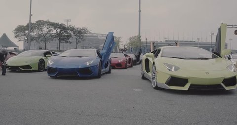 Paramus,NJ - 2/17/19 - Row of Lamborghinis with doors up rolling in parking lot. 