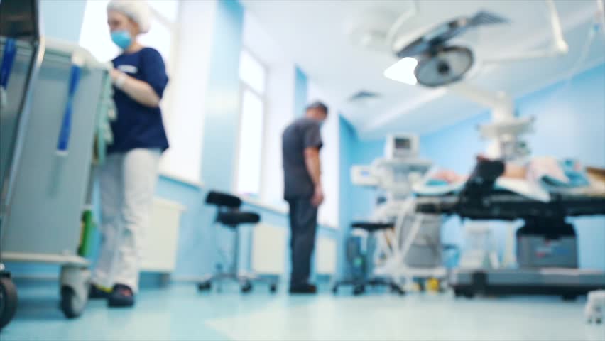 View of the operating room. A surgical medical team working in the modern operating room of the hospital was preparing the operating room for the operation. blur effect, blur video. | Shutterstock HD Video #1025716661