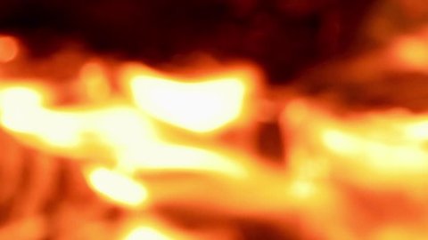 Vertical video. Bonfire close-up. Night. Defocus