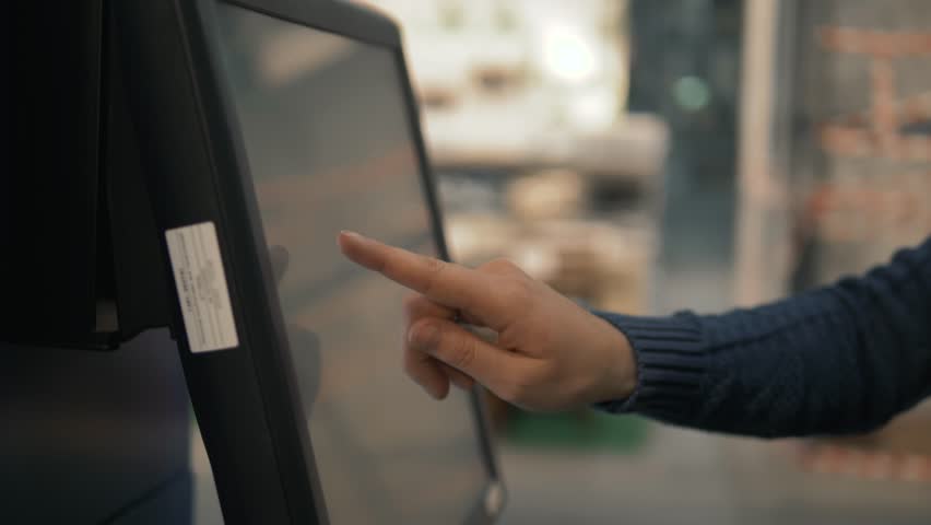 Smart retail sales and robot assistant or adviser technology concept. Woman using robo-advisor display text on screen in shop warehouse. Big navigation touchscreen | Shutterstock HD Video #1025722706