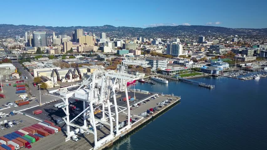 Stunning aerial drone view of bright day in Port of Oakland, California
