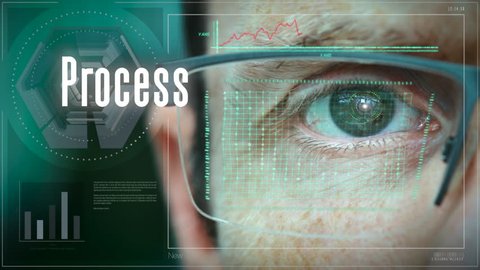 A close up of a businessman eye controlling a futuristic computer system with a Process Business concept.