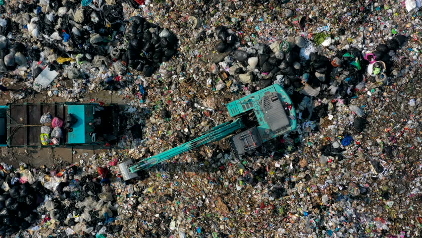 Garbage pile  in trash dump or landfill, Aerial view garbage trucks unload garbage to a landfill,  global warming, Ecosystem and healthy environment concepts and background, Time Lapse, Aerial view. | Shutterstock HD Video #1025729699