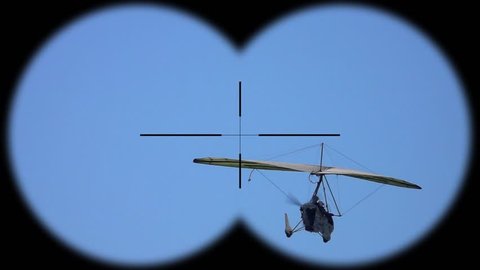 Flying Deltaplan Seen through Binoculars. Active Hobbi and Sport