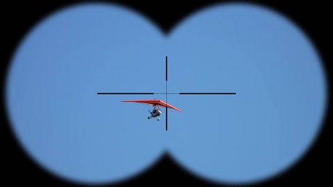 Flying Deltaplan Seen through Binoculars. Active Hobbi and Sport