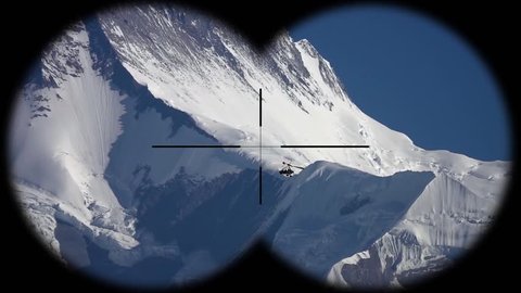 Deltaplan Flying over Highlands of Himalayan Mountains in Nepal Seen through Binoculars. Hiking, Mountaineering and Trekking