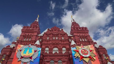 MOSCOW, RUSSIA – APRIL 30, 2018: Banners with medals and ribbons on the facade of Historical museum (Victory Day decoration) against the sky, Red Square, Moscow, Russia 