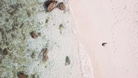 Aerial view of sunshine tropical sand beach, ocean texture, sea waves slow motion,  (Video from drone)