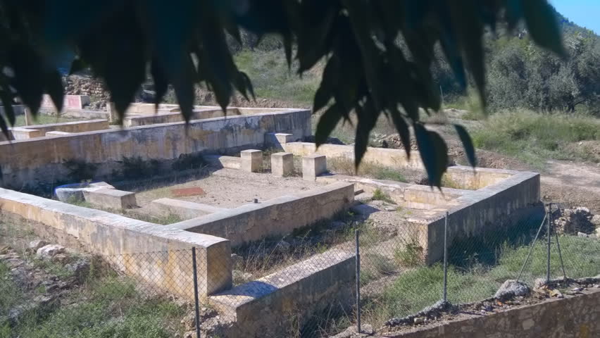The ruins of an ancient house are fenced and accepts tourists as a local landmark. Shot in motion
