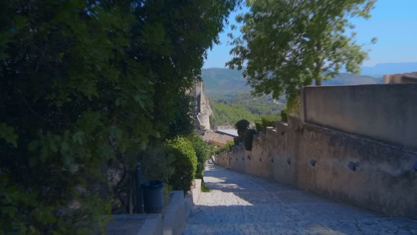 Against the blue sky inside the ancient castle in the wooded mountains of Spain attracts many tourists. Shot in motion