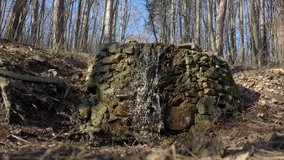 Man made waterfall deep in the woods 4K drone video