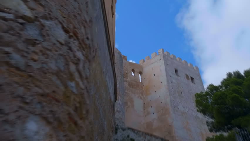 The ancient castle in the Spanish mountains is a national historical and cultural landmark, which is always visited by tourists. Shot in motion