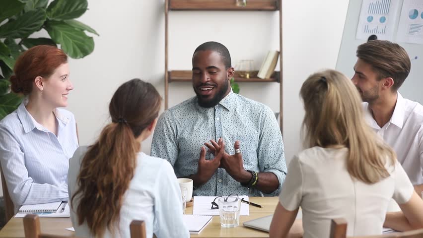 African american male business coach leader speaking at diverse team meeting seminar, black businessman mentor talking to office employees group teaching explaining work plan at workshop training Royalty-Free Stock Footage #1025766341