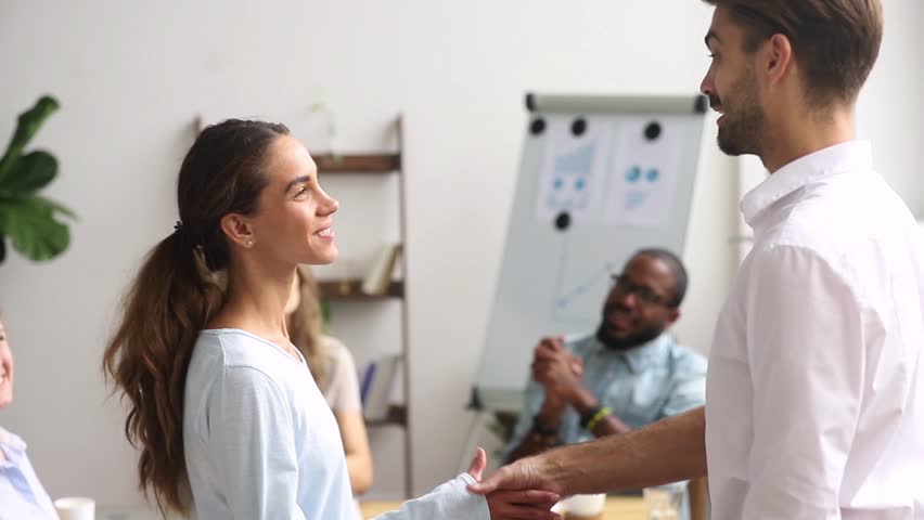 Executive leader boss handshaking excited happy proud intern employee congratulating promoting praising hiring, expressing gratitude thanking for good work results, respect recognition reward concept | Shutterstock HD Video #1025766347