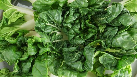 Green pok choy cabbage leaves, organic healthy food. Rotate