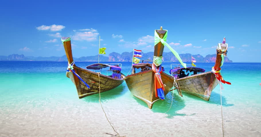 Thailand tourist boats on sea shore of tropical island near Krabi and Phuket. Travel destination background of exotic Asia | Shutterstock HD Video #1025779223