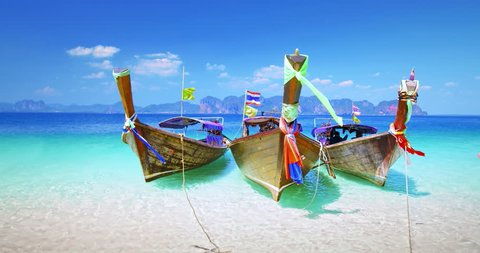 Thailand tourist boats on sea shore of tropical island near Krabi and Phuket. Travel destination background of exotic Asia