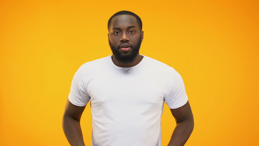 Young black guy making success gesture with hands, isolated on yellow background | Shutterstock HD Video #1025781200