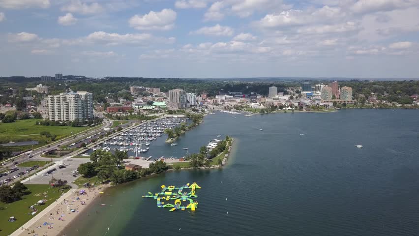 Flying with drone above downtown of Barrie and Lake Simcoe 4k