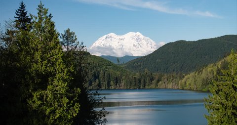 Mount Rainier Snowy Mountain Peak Above Lake Timelapse Pacific Northwest Washington State Sunny Day