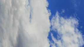 Vertical video. Clouds in the sky when the wind is strong. Time Lapse.